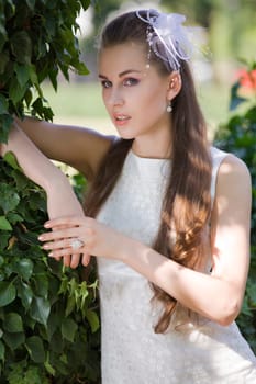 young bride waiting in park
