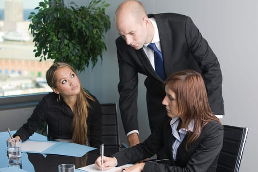 Two businesswomen and boss