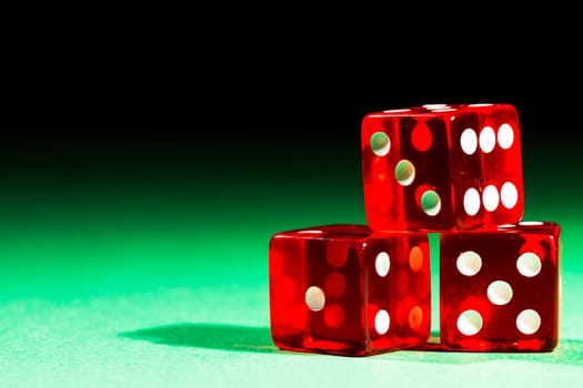 Three red cubes on green