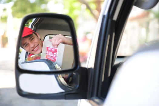 Parcel deliverer in van