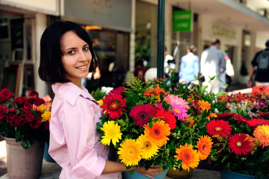 Woman with many flowers