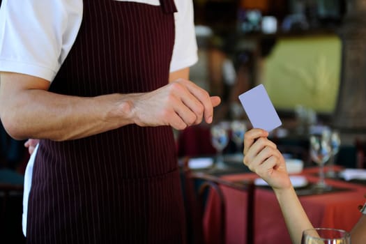 Customer paying in restaurant with card