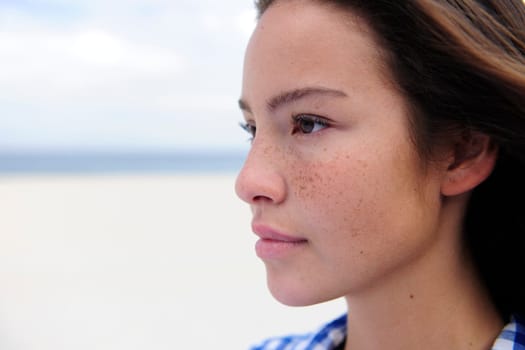 Portrait of a beautiful woman with freckles