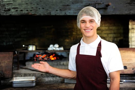 Man working in a restaurant with charcoal stove
