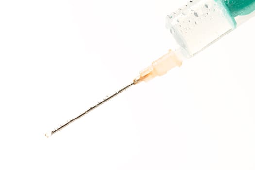 Wet syringe on white