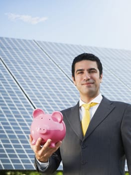 businessman and solar panels