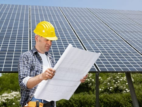 businessman and solar panels