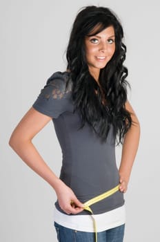 girl measuring her hip half