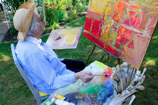 Senior woman painting
