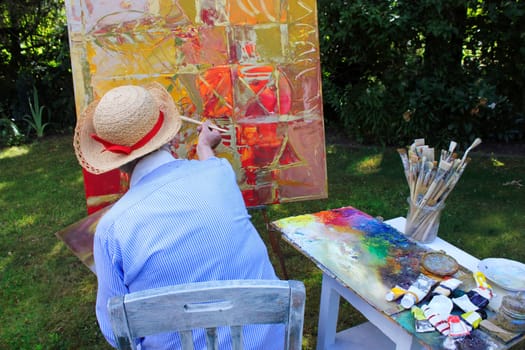 Senior woman painting