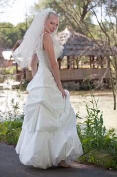 happy bride posing outdoor
