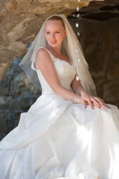 happy bride sitting and waiting
