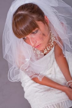 sad bride on the ground