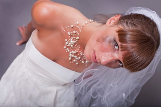 crying bride on the ground