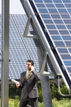 businessman and solar panels