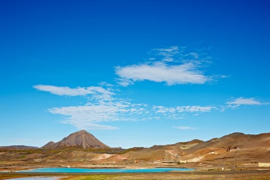 Beautiful clouds over the Bjarnarflag Mountain and diatomite pla