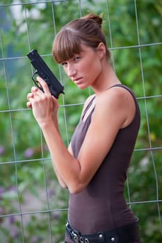 female agent with gun
