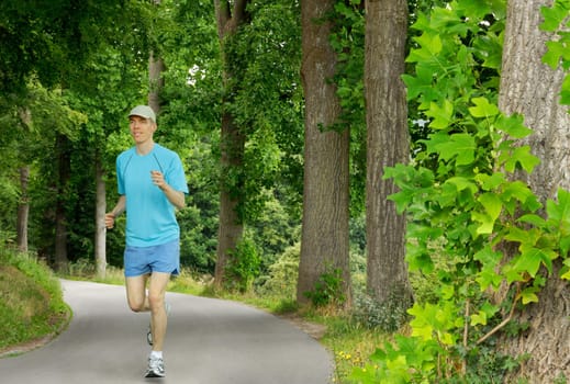 Cheerful jogger in beautiful nature