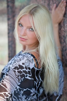 blond woman at the wall
