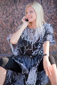 blond woman with cell phone