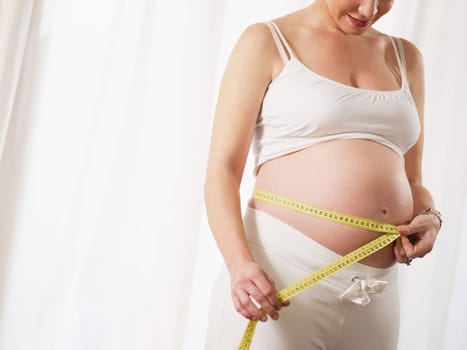 pregnant woman drinking water