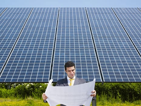 businessman and solar panels