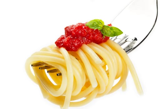 Spaghetti on fork sauce basil