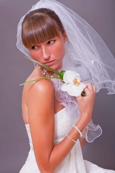 sad and sensual bride with flower