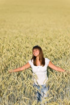 Happy woman in corn field enjoy sunset