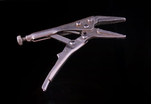 Chrome vice grip on a white background.