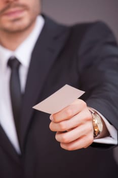 man giving business card