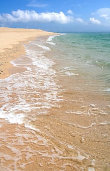 Sea, sand, and clouds