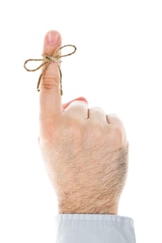 String tied on finger as reminder