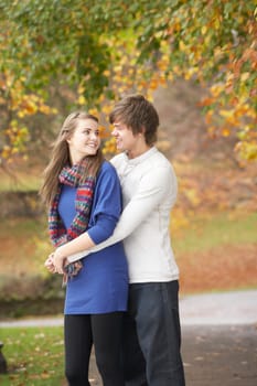 Romantic Teenage Couple In Autumn Park