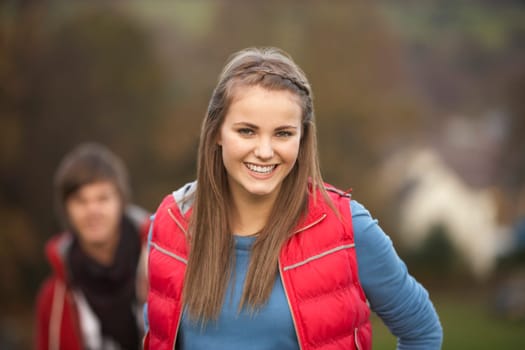 Teenage Girl Outside With Boyfriend In Background