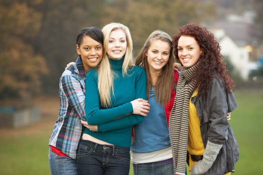 Group Of Four Teenage Girls In Autumn Landscape