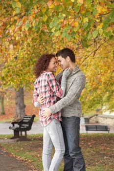 Romantic Teenage Couple In Autumn Park