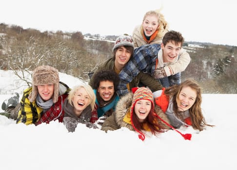 Group Of Teenage Friends Having Fun In Snowy Landscape