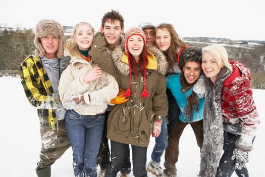 Group Of Teenage Friends Having Fun In Snowy Landscape