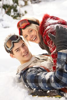 Romantic Teenage Couple Having Fun In Snow
