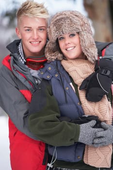 Romantic Teenage Couple In Snow