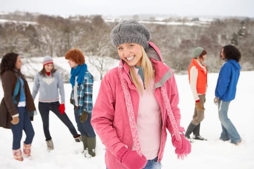 Group Of Young Friends Having Fun In Snowy Landscape