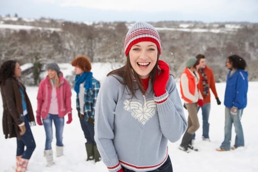 Group Of Young Friends Having Fun In Snowy Landscape
