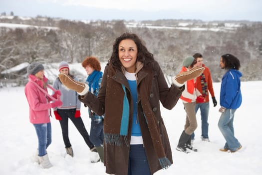 Group Of Young Friends Having Fun In Snowy Landscape
