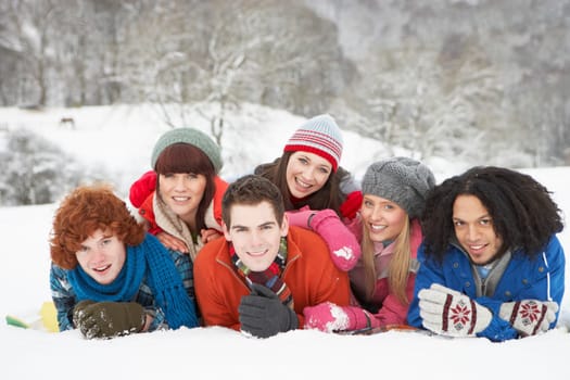 Group Of Teenage Friends Having Fun In Snowy Landscape