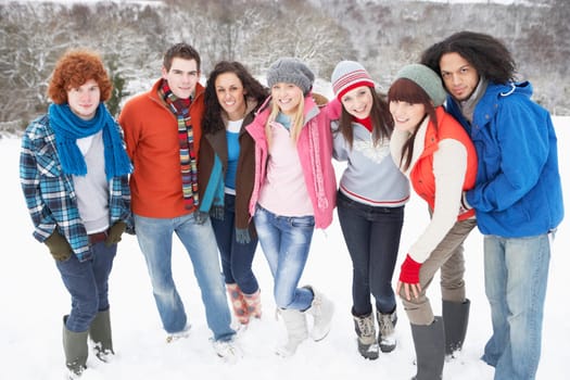 Group Of Teenage Friends Having Fun In Snowy Landscape