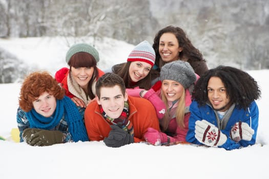 Group Of Teenage Friends Having Fun In Snowy Landscape