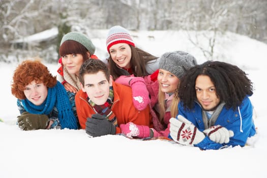 Group Of Teenage Friends Having Fun In Snowy Landscape