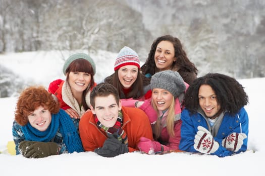 Group Of Teenage Friends Having Fun In Snowy Landscape