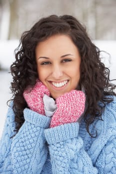 Woman In Snowy Landscape Wearing Warm Clothing